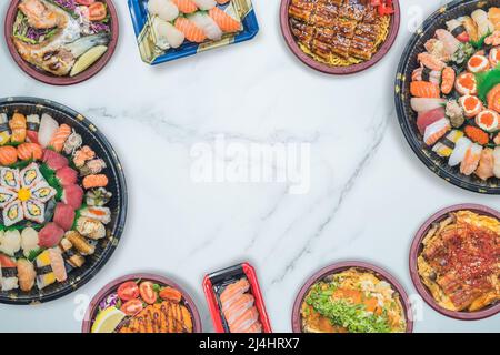 Takeaway boxed sushi gathering party with Japanese food platter bird's eye view shooting food stock photo Stock Photo