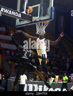 Cairo, Egypt. 15th Apr, 2022. Nyang Wek (R) of Cobra Sport blocks a shot of Myck Kabongo of Cape Town Tigers during the match between Cobra Sport of South Sudan and Cape Town Tigers of South Africa at the 2022 Basketball Africa League (BAL) in Cairo, Egypt, April 15, 2022. Credit: Ahmed Gomaa/Xinhua/Alamy Live News Stock Photo