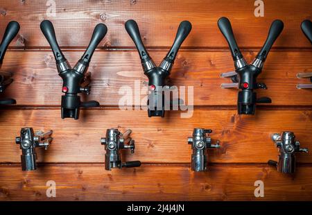 Beer taps for draught drinks are built into wooden boards Stock Photo