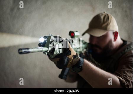 Armed soldier ready for battle. Military concept. Stock Photo