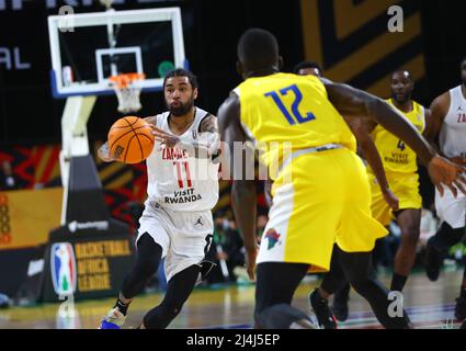 Cairo, Egypt. 15th Apr, 2022. Mikhael Mckinney (L) of Zamalek passes the ball during the match between Zamalek of Egypt and Petro de Luanda of Angola at the 2022 Basketball Africa League (BAL) in Cairo, Egypt, April 15, 2022. Credit: Ahmed Gomaa/Xinhua/Alamy Live News Stock Photo