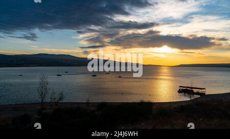 Tbilisi sea and boat with deflated sails. Landscape. Sunrise Stock Photo