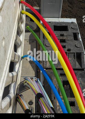 Fiber optic cable on a construction site for the provision of a fast internet connection Stock Photo