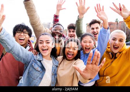 Big group of cheerful Motivated and excited young friends taking selfie portrait. Happy people looking at the camera smiling. Concept of community Stock Photo