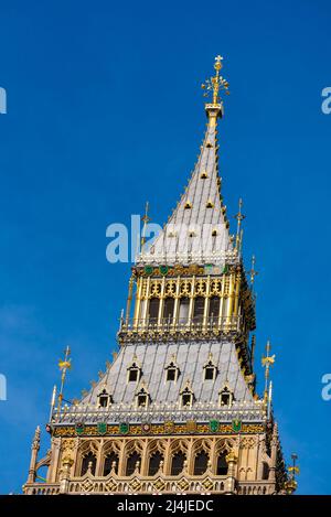 Upper detail of recently uncovered restored Elizabeth Tower, Big Ben, of the Palace of Westminster, London. Bright colours. Gold coloured detailing Stock Photo