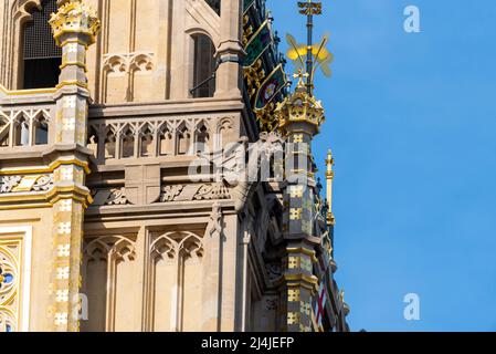 Upper detail of recently uncovered restored Elizabeth Tower, Big Ben, of the Palace of Westminster, London. Bright colours. Gold coloured detailing Stock Photo