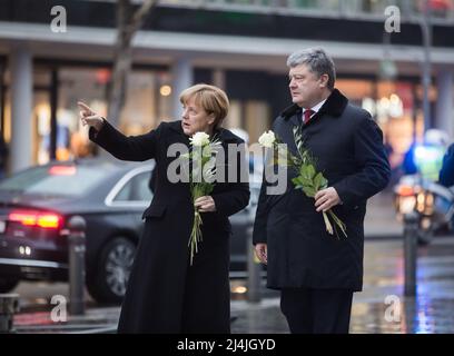 Berlin, Germany. 30th Jan, 2017. President of Ukraine Petro Poroshenko (R), and German Chancellor Angela Merkel (L) visited the place of tragedy, which occurred in the center of western Berlin December 19, 2016. German Chancellor Angela Merkel (archival image) (Photo by Mikhail Palinchak/SOPA Images/Sipa USA) Credit: Sipa USA/Alamy Live News Stock Photo