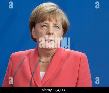 Berlin, Germany. 24th Aug, 2015. Chancellor of the Federal Republic of Germany Angela Merkel during a joint briefing with President of Ukraine Petro Poroshenko and French President Francois Hollande. (Photo by Mikhail Palinchak/SOPA Images/Sipa USA) Credit: Sipa USA/Alamy Live News Stock Photo