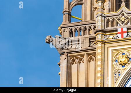 Upper detail of recently uncovered restored Elizabeth Tower, Big Ben, of the Palace of Westminster, London. Bright colours. Gargoyle and detailing Stock Photo