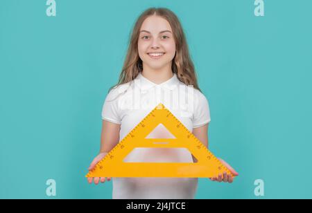 cheerful child with math triangle measuring tool Stock Photo