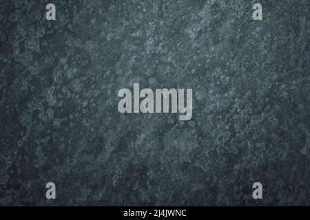 Dark worn blue and black surface background with stained texture Stock Photo