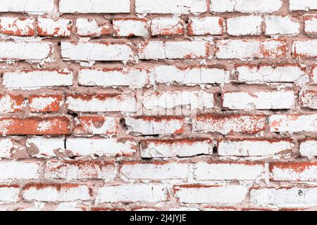 White brick wall with weathered paint, high detailed texture background Stock Photo