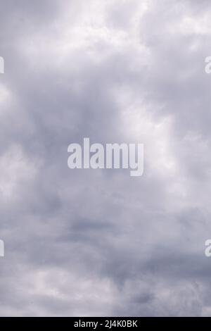 cloudy and gloomy sky. Shades of gray and white in full frame. Stock Photo