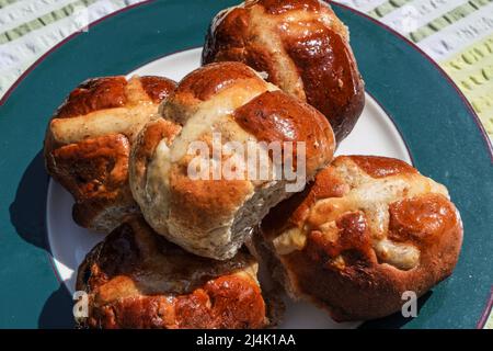 A simple plate of large hand made hot cross buns Stock Photo