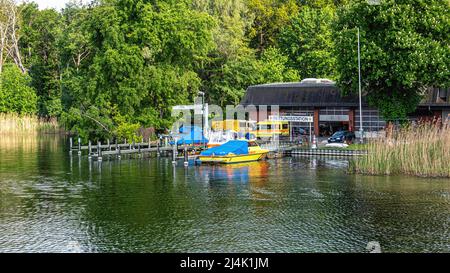 Lifesaving & Rescue Station with ambulance & moored boat on the banks of the Lake Tegel, Berlin Stock Photo