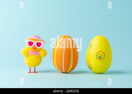 Holiday layout with colorful easter eggs and chicken. Easter minimal concept. Creative Happy Easter or spring layout. Stock Photo