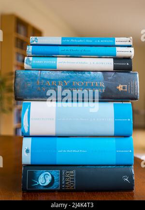 Display of pile of Harry Potter series of books on a table by J K Rowling, UK Stock Photo
