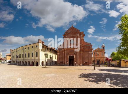 Villafalletto, Cuneo, Italy - April 15, 2022: from the right the church of the Bianca, the parish church of SS Pietro e Paolo and Palazzo Maggiore, se Stock Photo