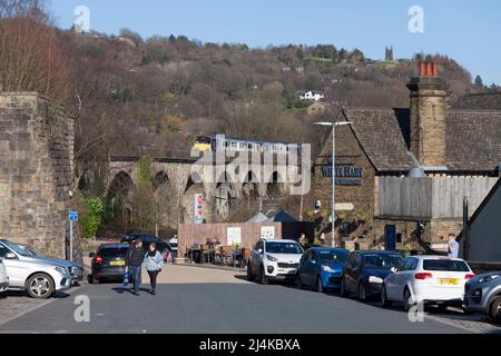 Todmorden Viaduct, Yorkshire, UK Northern Rail class 150 trains crossing passing a Weatherspoons pub Stock Photo
