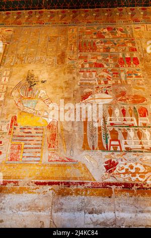 Painting image on the wall of God Anubis Shrine in Mortuary Temple of Hatshepsut at Valley of The Kings, Luxor, Upper Egypt. Anubis presented with bou Stock Photo