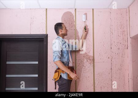 Young Male Technician Installing Security System Stock Photo