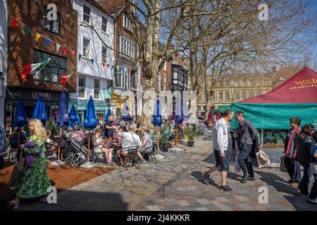 Outdoor cafes full of people at the Salisbury Saturday Market in Salisbury, Wiltshire, UK on 16 April 2022 Stock Photo