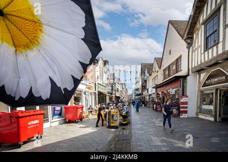 Shops and busy cafes in Butcher Row in Salisbury, Wiltshire, UK on 16 April 2022 Stock Photo
