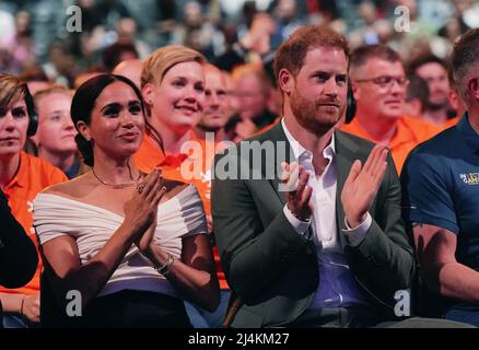 The Duke and Duchess of Sussex watch the Invictus Games opening ceremony at Zuiderpark the Hague, Netherlands. Picture date: Saturday April 16, 2022. Stock Photo