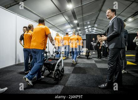 THE HAGUE - Prime Minister Mark Rutte greets the athletes of the Dutch Invictus team prior to the opening ceremony of the Invictus Games, an international sporting event for soldiers and veterans who have been psychologically or physically injured during their military work. ANP POOL KOEN VAN WEEL Stock Photo