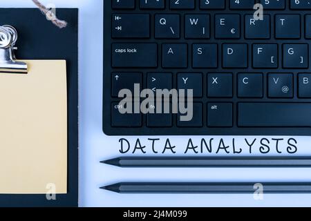 Writing displaying text Data Analysts. Conceptual photo Programmer Design and Create Report Identifies patterns Computer Keyboard And Symbol Stock Photo