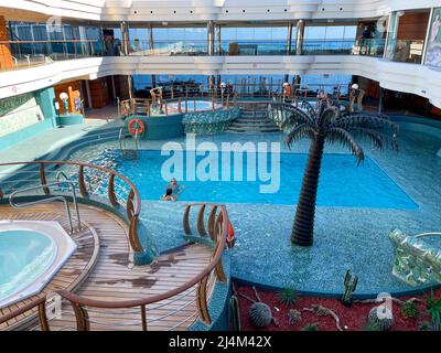 Orlando, FL USA - October 11, 2021:  The solarium swimming pool area on the MSC Cruise Ship Divina in Port Canaveral, Florida., Stock Photo