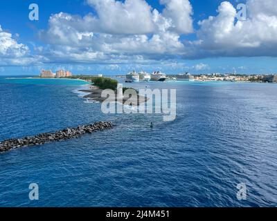 Nassau, Bahamas - October 13, 2021: An aerial view of the cruise ship harbor in Nassau, Bahamas from a cruise ship that is sailing away. Stock Photo