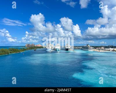 Nassau, Bahamas - October 13, 2021: An aerial view of the cruise ship harbor in Nassau, Bahamas from a cruise ship that is sailing away. Stock Photo