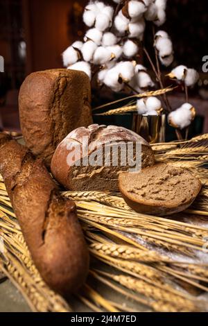 Different types of bread on a wooden background. Bakery products Stock Photo