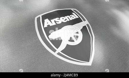 Waving flag with Arsenal football team logo, close-up. Motion. Black and white professional english football club flag, seamless loop. For editorial Stock Photo