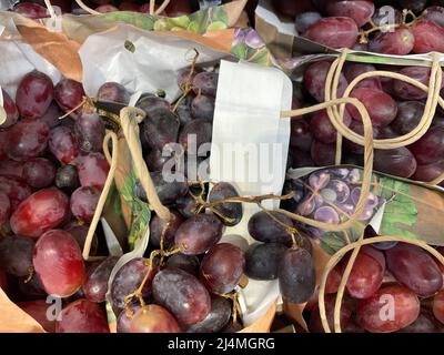 Delicious grapes on display in a retail store. Stock Photo