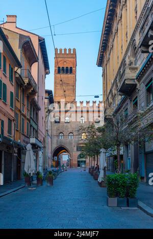 Bologna, Italy, September 22, 2021: Narrow street leading to the Podesta palace in Bologna, Italy. Stock Photo