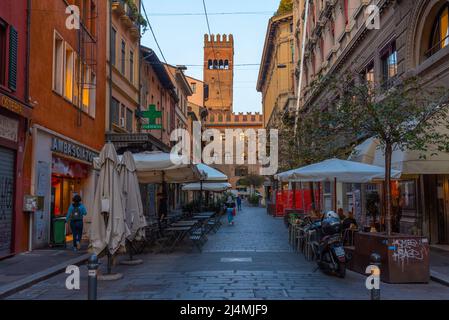 Bologna, Italy, September 22, 2021: Narrow street leading to the Podesta palace in Bologna, Italy. Stock Photo