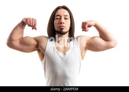 Young long-haired sportsman shows biceps posing studio shot isolated white background indoors copy space . High quality photo Stock Photo