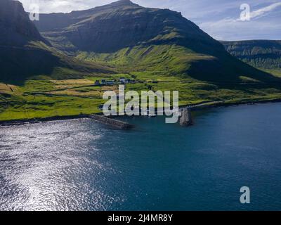 Beautiful aerial view of Sydradalur port and village near the Seal woman statue in the Faroe Islands Stock Photo