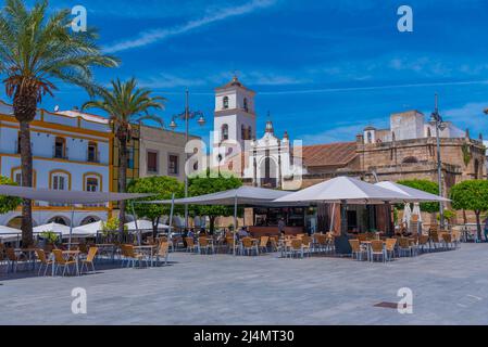 Merida, Spain, May 20, 2021: Cathedral viewed through Plaza de Espana in Spanish town Merida Stock Photo