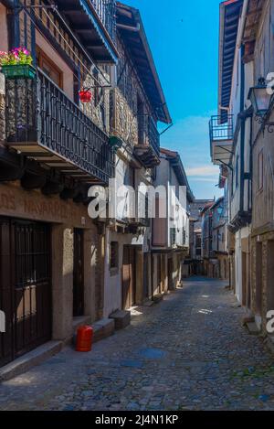 Timber houses alongside a narrow street in La Alberca village in Spain Stock Photo