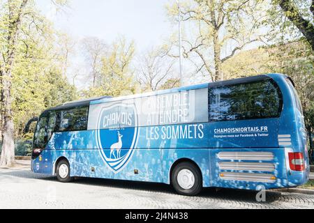 Strasbourg; France - Apr 11; 2022: Side view of blue Man bus coach with Chamois Niortais soccer team - French association football club based in the commune of Niort; in the Deux-Sevres department of western France. It was founded in 1925 by Charles Boinot Stock Photo