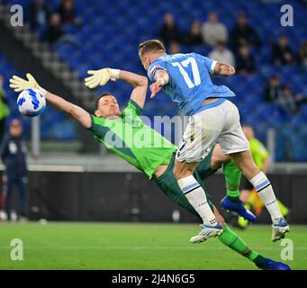 Rome, Italy. 16th Apr, 2022. Lazio's Ciro Immobile (R) scores during a Serie A football match between Lazio and Torino in Rome, Italy, on April 16, 2022. Credit: Alberto Lingria/Xinhua/Alamy Live News Stock Photo
