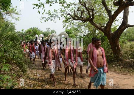 Santiniketan, West Bengal, India. 16th Apr, 2022. Dharma Thakur is a Hindu deity, symbolising the sun, some say it is a Hindu deity of death and justice, worshipped by villagers in the traditional Rarh region in the present-day Indian state of West Bengal as one of their special village gods (gram devata). Dharmaraja or Dharma Thakur was originally a non-Aryan god and a deity of the Kom tribe but was later elevated to the Vedic pantheon. Dharma Thakur is associated with agricultural and human fertility. Magical beliefs and rituals merge with Vedic rites in his worship. He is worshipped mainly Stock Photo