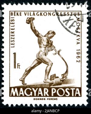 HUNGARY - CIRCA 1962: Postage stamp printed in Hungary, showing sculpture 'Let Us Beat Swords into Plowshares', by Evgeniy Vuchetich, circa 1962 Stock Photo