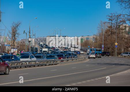 Big traffic jam on the city road. Highway with heavy traffic. Moscow Russia April 14, 2022. Stock Photo