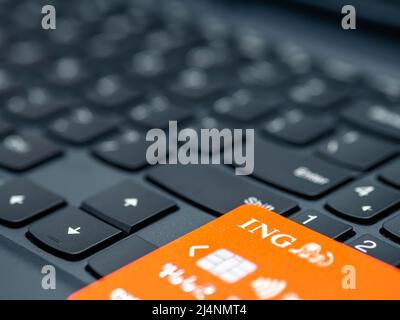 Bucharest, Romania - 03.25.2022: ING Dutch bank credit or debit card on a computer keyboard. Online electronic commerce concept Stock Photo