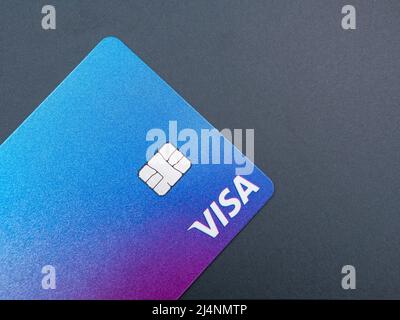 Bucharest, Romania - 03.25.2022: Visa credit or debit card on grey background. Online electronic commerce concept Stock Photo