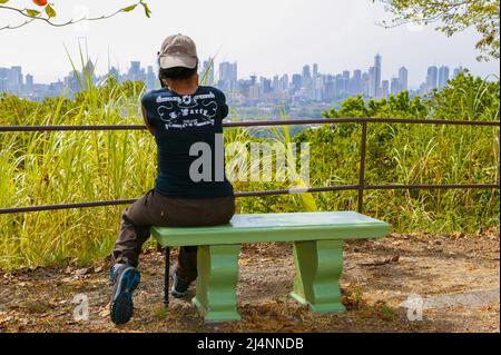 A tourist is taking pictures in Metropolitan park, Panama City, Panama province, Republic of Panama, Central America. Stock Photo